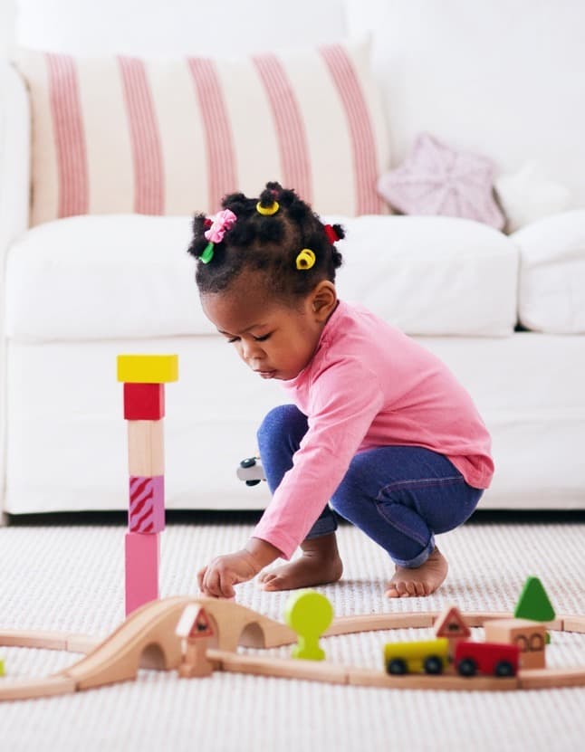 Parent and child during a play-based speech therapy session at home